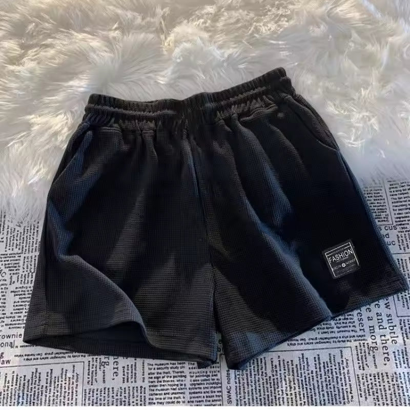 Men's black quick-dry 2-in-1 running shorts with built-in liner and zip phone pocket