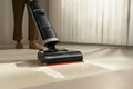 Cordless handheld mini vacuum in use