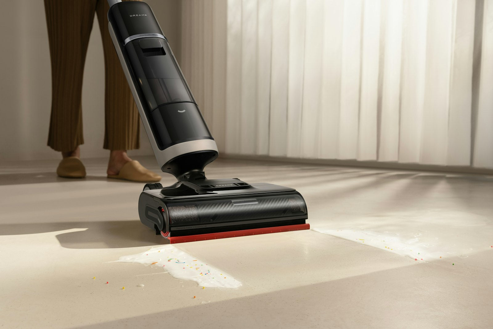 Cordless handheld mini vacuum in use